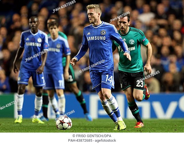 Schalke's Christian Fuchs (R) and Andre Schürrle (L) of Chelsea vie for the ball during the UEFA Champions League group E soccer match between Chelsea FC and FC...