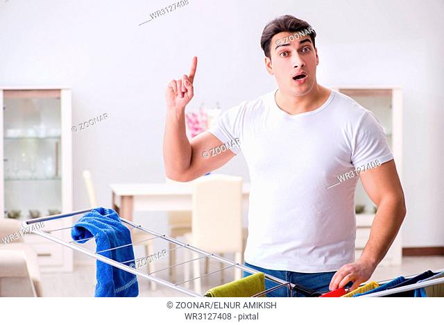 The man doing laundry at home