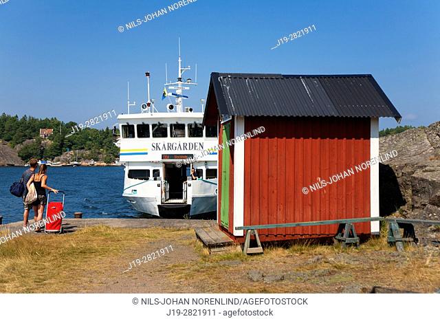 Passenger boat arriving at port, Swedish archipelago near Stockholm