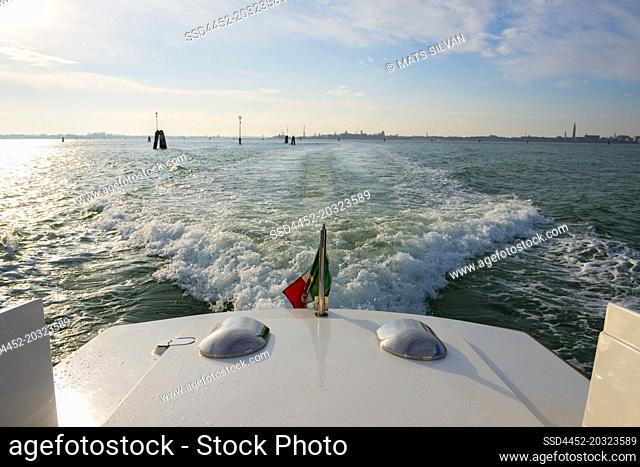 Elegant Motorboat with Italian Flag Travel on Mediterranean Sea in a Sunny Day in Venice, Veneto in Italy