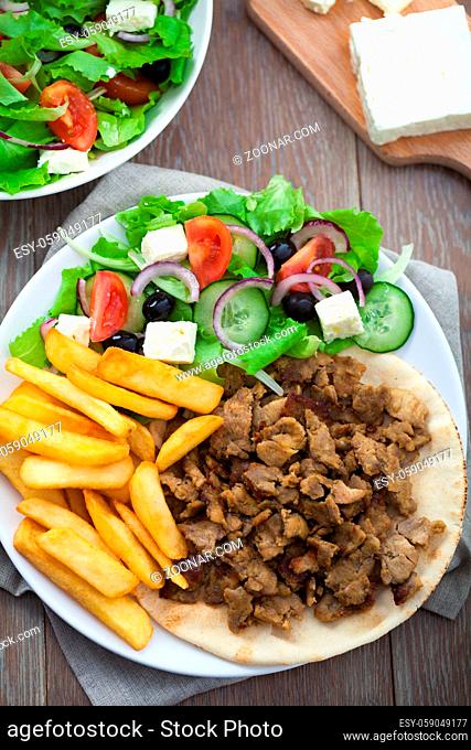 Greek Gyros with Fries and Salad on a Plate