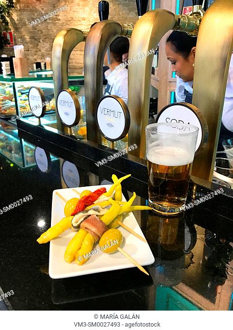 Tapa called Gilda and glass of beer in a bar. Spain
