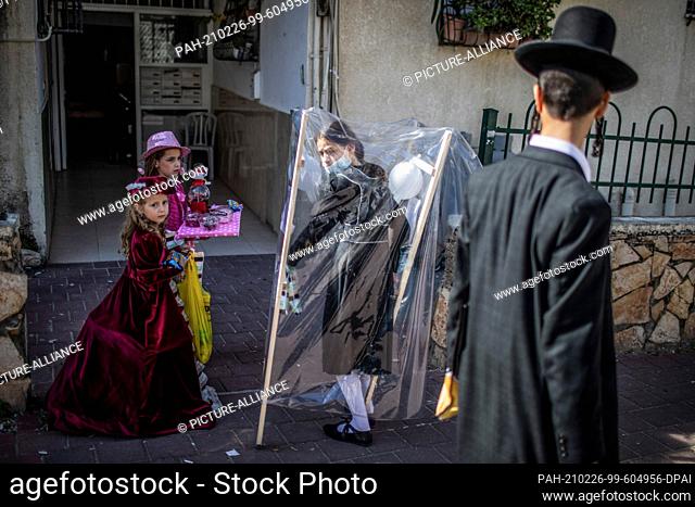 26 February 2021, Israel, Bnei Brak: Costumed Jewish girls take part in celebrations marking Purim, also called the Festival of Lots
