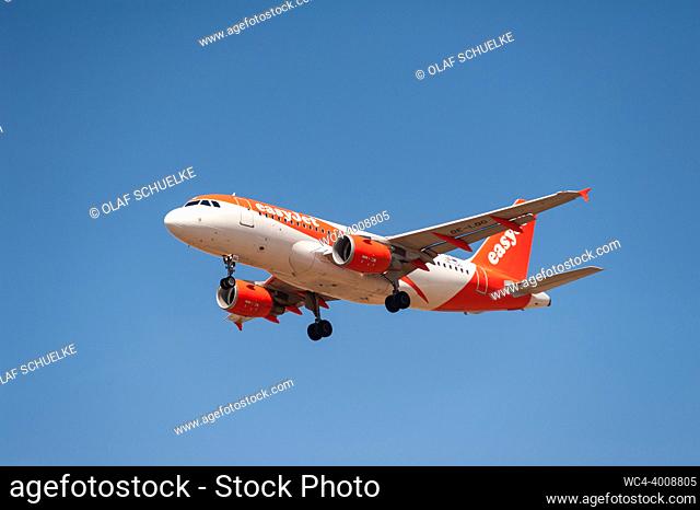 Berlin, Germany, Europe - An EasyJet Europe Airbus A319-100 passenger aircraft with the registration OE-LQG approaches Berlin Brandenburg Airport BER for...