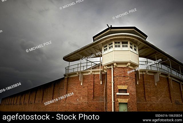 Bogo Road Gaol watch tower against stormy sky