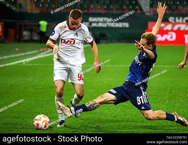 RUSSIA, MOSCOW - SEPTEMBER 18, 2023: Lokomotiv's Dmitry Rybchinsky (L) and Orenburg's Maxim Sidorov are in action in a 2023/24 Russian Premier League Round 8...