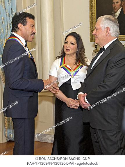 Lionel Richie, left, and Gloria Estefan, center, two of the five recipients of the 40th Annual Kennedy Center Honors speak with United States Secretary of State...