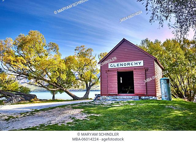 New Zealand, south island, old red hut at the lake, Glenorchy, trees, crooked
