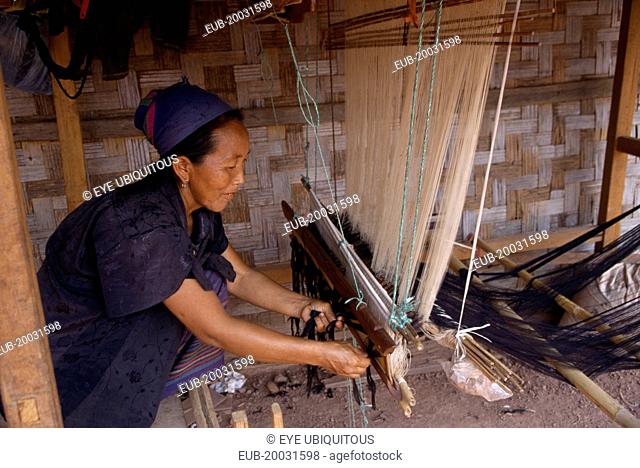 Hmong woman weaving on hand loom