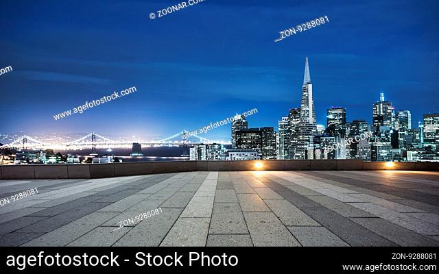 empty pavement with cityscape and skyline of san francisco at twilight