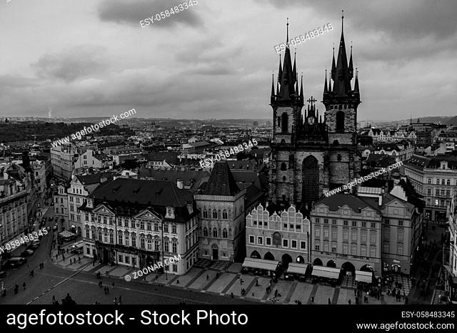 A black and white picture of the Old Town Square, in Prague
