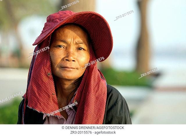 Portrait of a Cambodian woman along Mekong River early in the morning in Phnom Penh, Cambodia
