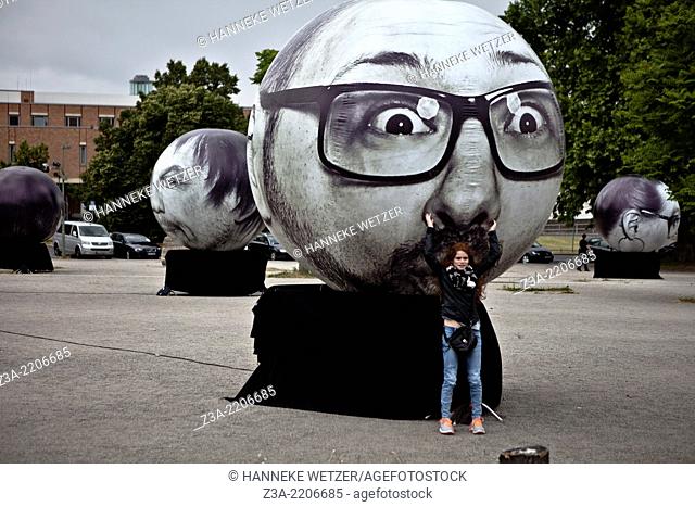 Street Art balloons with emotional heads at the Potsdamerplatz in Berlin