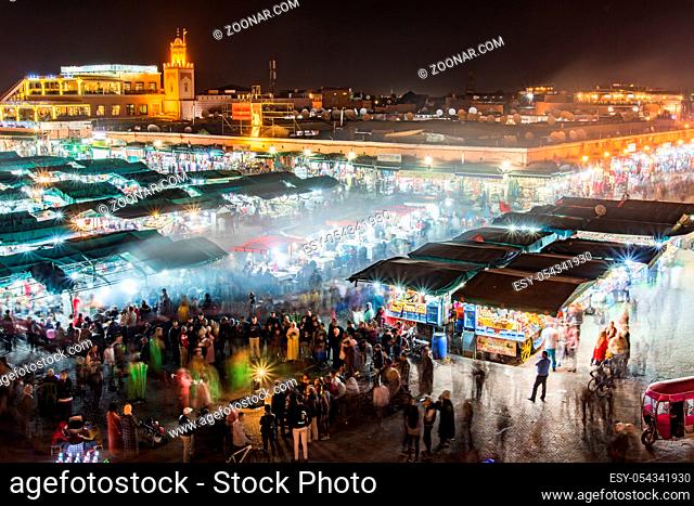 Famous local market square Jamma El Fna in Marrakesh, Morocco. Night aeriel view with motion blur