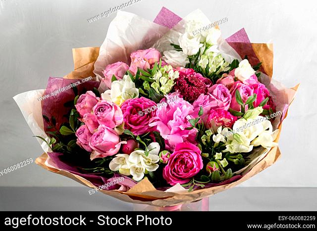 luxurious and elegant bouquet of roses and Other flowers. Composition colors on gray background. Copy space