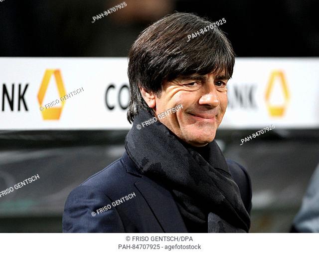Germany's head coach Joachim Loew smiles at the World Cup qualifying soccer match between Germany and Northern Ireland in the HDI Arena in Hanover, Germany