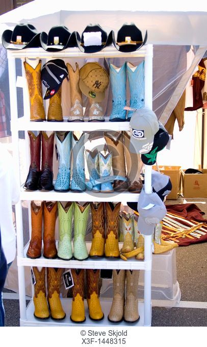 Fancy Mexican western style cowboy boots on display at sidewalk vendors shop  Cinco de Mayo Fiesta St Paul Minnesota USA
