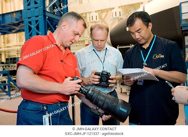 Russian cosmonaut Oleg Kotov (center), Expedition 22 flight engineer and Expedition 23 commander; NASA astronaut T.J. Creamer (left) and Japan Aerospace...