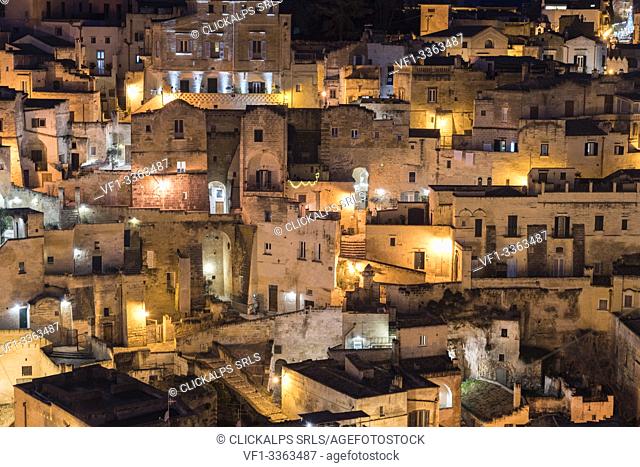 Close-up on the old houses of the Sassi quarter at night. Matera, Basilicata region, Italy
