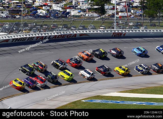 The Monster Energy NASCAR Cup Series cars race off turn four during the GEICO 500 at Talladega Superspeedway in Talladega, Alabama