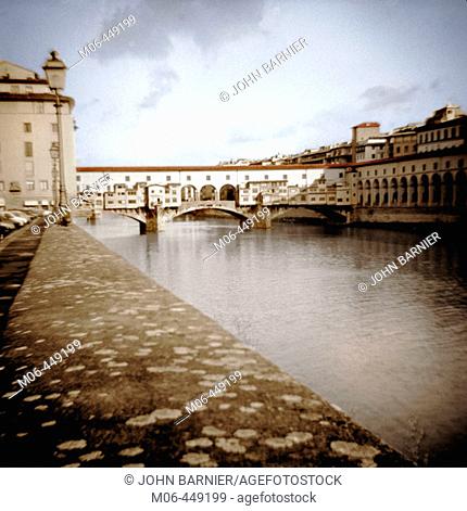 A view of the Ponte Vecchio Bridge over the Arno River in Florence, Italy