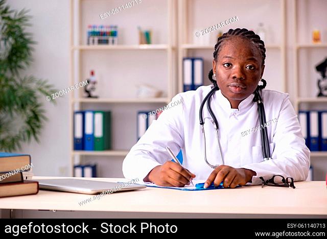 Black female doctor working at clinic