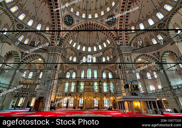 Istanbul, Turkey - April 21, 2017: Fatih Mosque, a public Ottoman mosque in the Fatih district with a huge decorated domes many colored stained glass windows