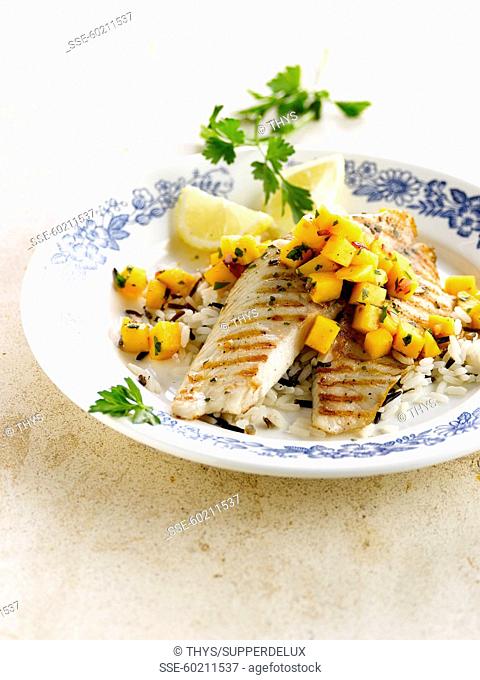 Grilled tilapia with diced mango and black and white rice