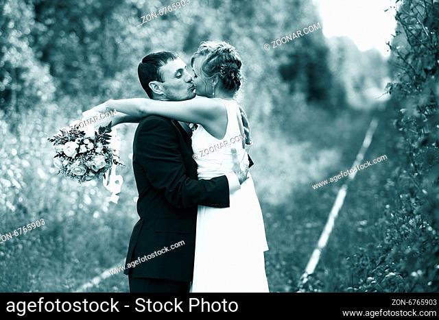 Romantic wedding Couple kissing outdoors