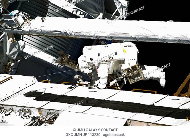 NASA astronaut Michael Fincke participates in the mission's fourth session of extravehicular activity (EVA) as construction and maintenance continue on the...