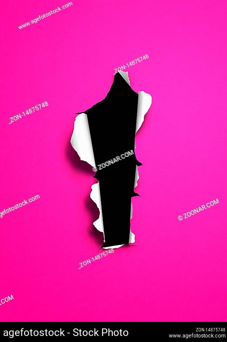 Pink torn paper with black hole. blank background template