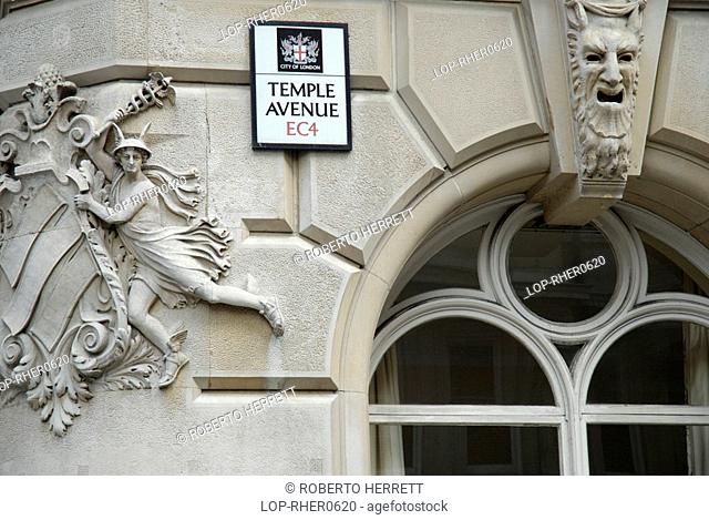 England, London, The City, Carvings on the side of a white stone building in Temple Avenue