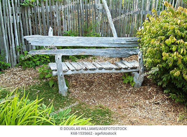 Wooden bench in a garden on Hornby Island, BC, Canada