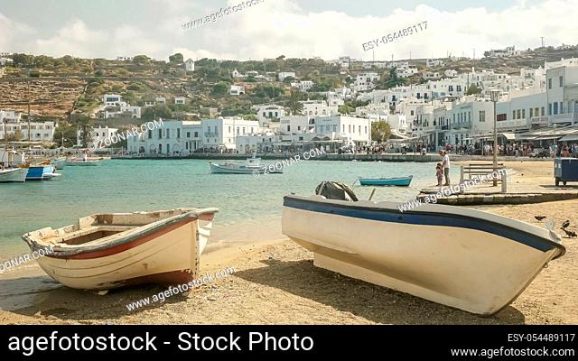 two fishing boats on the beach in the town of chora on the island of mykonos greece