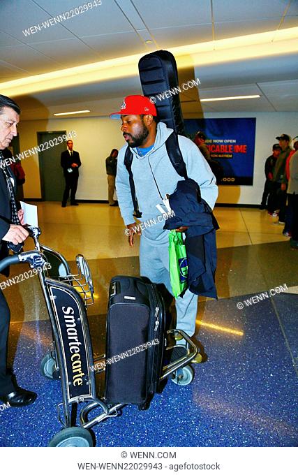 Malcolm-Jamal Warner arrives on a flight to Los Angeles International Airport (LAX) carrying a guitar case on his back Featuring: Malcolm-Jamal Warner Where:...