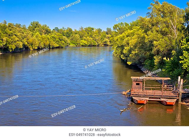 Mura river ferry boat and green landscape, Medjimurje region of Croatia