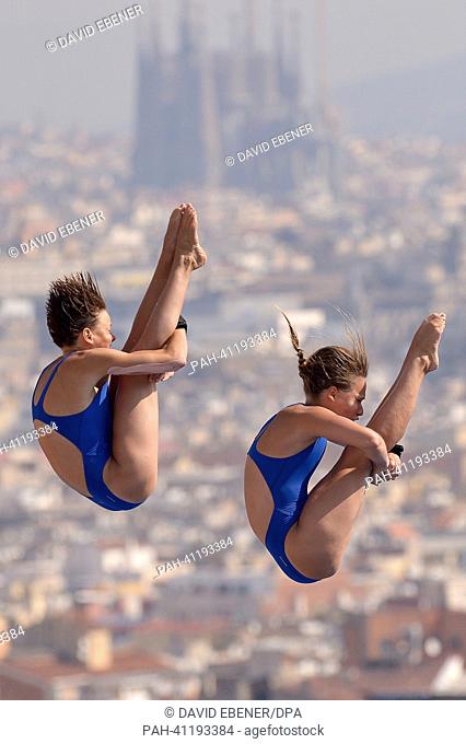 Maria Kurjo (R) and Julia Stolle of Germany in action during the women's 10m Synchro Platform diving preliminaries of the 15th FINA Swimming World Championships...