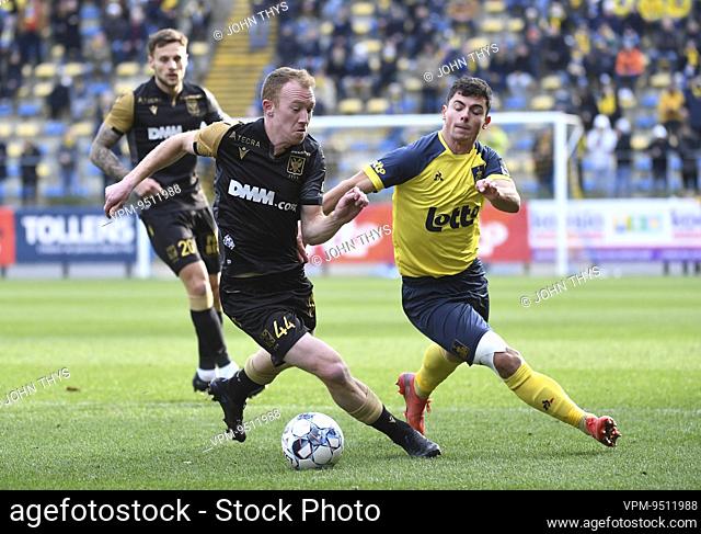 STVV's Christian Bruls and Union's Dante Vanzeir fight for the ball during a soccer match between Royale Union Saint-Gilloise and Sint-Truidense VV
