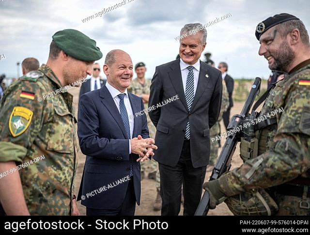 07 June 2022, Lithuania, Pabrade: German Chancellor Olaf Scholz (SPD), alongside Daniel Andrä, Bundeswehr Commander of the NATO Enhanced Forward Presence Battle...