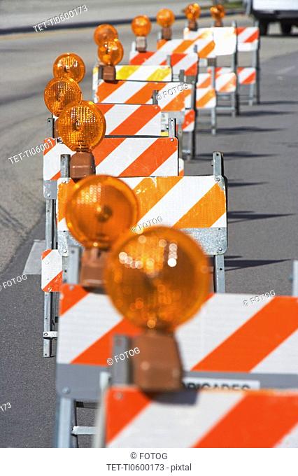 Row of traffic barricades with lights