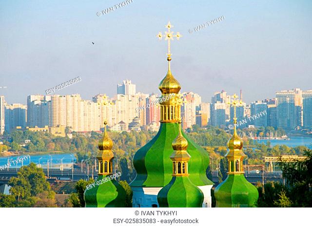 View of Vydubychi Monastery cupola and modern Osokorky district on the background. Kiev, Ukraine