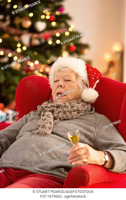 Senior woman having a catnap at Christmas time
