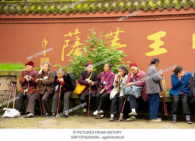 China: Pilgrims at Baoguo Si (Declare Nation Temple), at the foot of Emeishan (Mount Emei), Sichuan Province