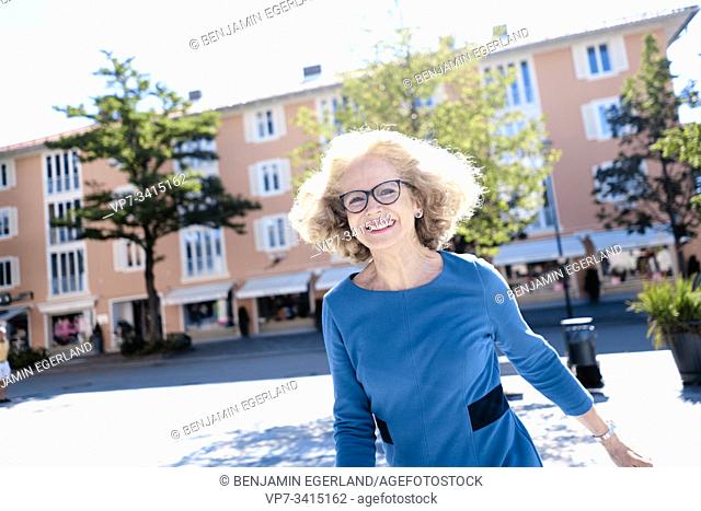 Happy active senior woman. Starnberg, Bavaria, Germany
