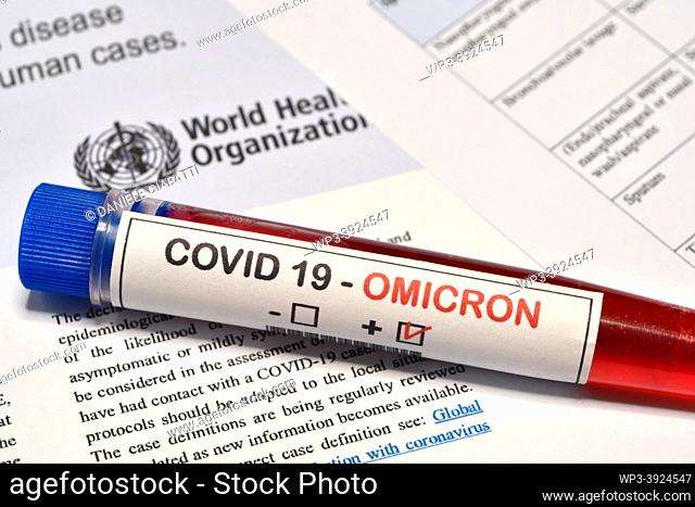 Florence: Blood tube for test detection of virus Covid-19 Omicron Variant with positive result on papers document