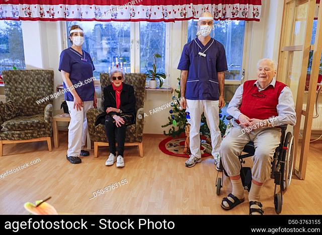 Stockholm, Sweden Two nurses stand with two seniors after administering the Pfizer-BioNTech Covid-19 vaccine in a senior home