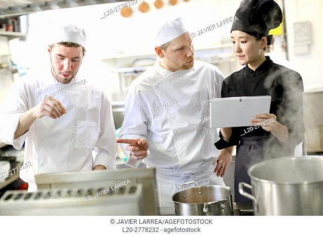 Chef with tablet, Cooks in cooking school, Cuisine School, Donostia, San Sebastian, Gipuzkoa, Basque Country, Spain, Europe