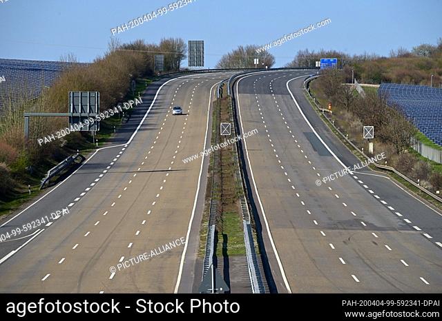 04 April 2020, Hessen, Malsfeld: There is little traffic on the north-south axis A7 Höhe exit Malsfeld. Despite the beginning of the Easter holidays