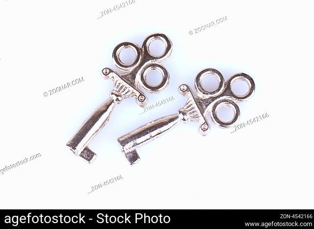 Two old keys on a white background