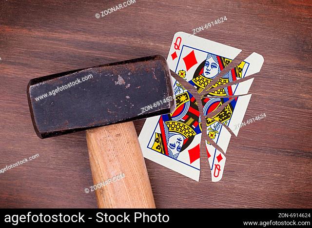 Hammer with a broken card, vintage look, queen of diamonds
